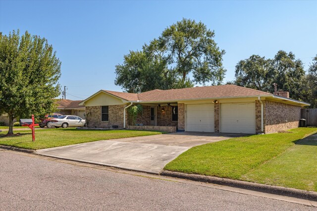 ranch-style home featuring a garage and a front lawn