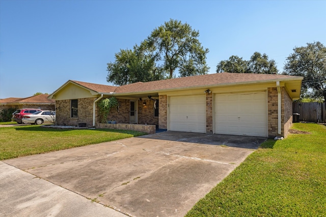 ranch-style house featuring a front yard and a garage