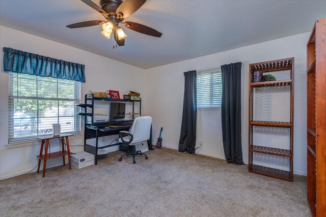 office featuring light carpet and ceiling fan