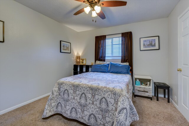 bedroom with light colored carpet and ceiling fan