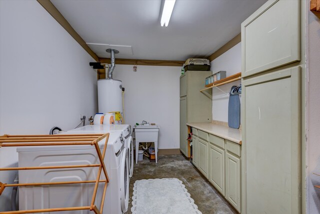 laundry area featuring cabinets, water heater, and washer and clothes dryer