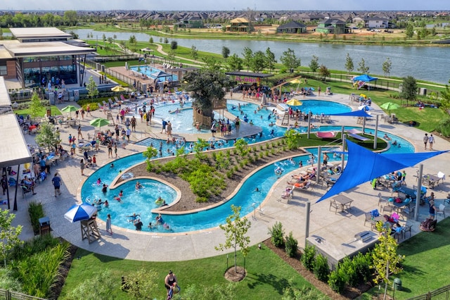 birds eye view of property featuring a water view