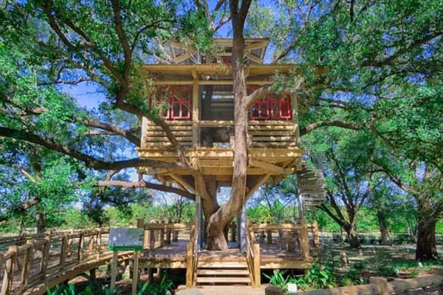 view of playground with a wooden deck