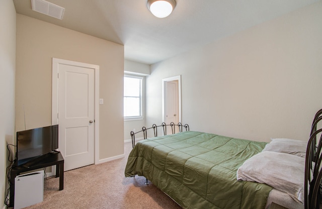 bedroom with light carpet