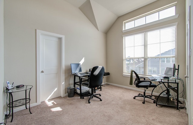 office area with light carpet and lofted ceiling