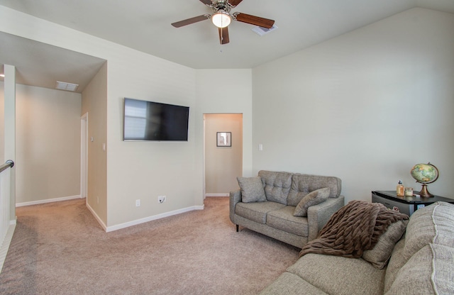 carpeted living room featuring ceiling fan and vaulted ceiling