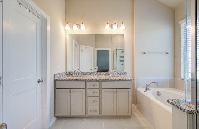 bathroom featuring vanity, independent shower and bath, and tile patterned flooring