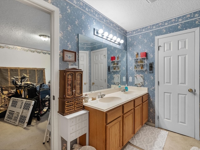 bathroom with vanity and a textured ceiling