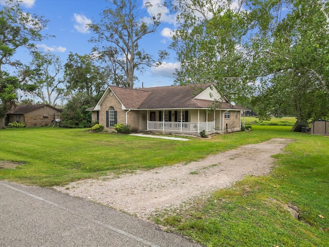 view of front facade with a front yard and a porch