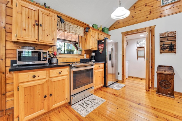 kitchen featuring lofted ceiling, light brown cabinetry, stainless steel appliances, light hardwood / wood-style floors, and decorative light fixtures