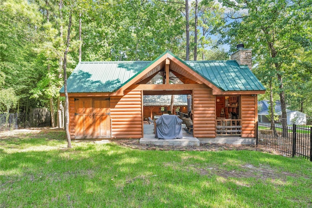 view of outbuilding featuring a yard