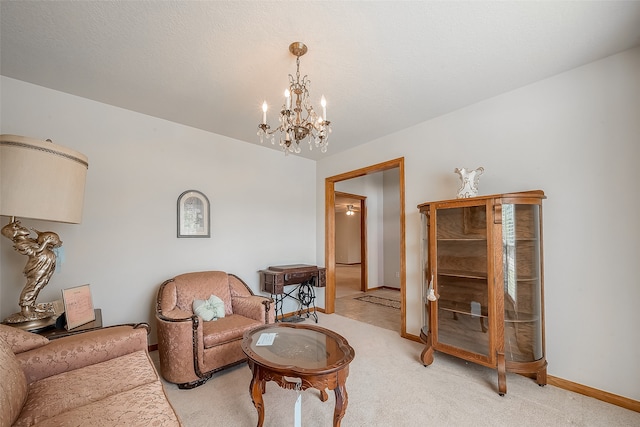 living room with an inviting chandelier and light colored carpet