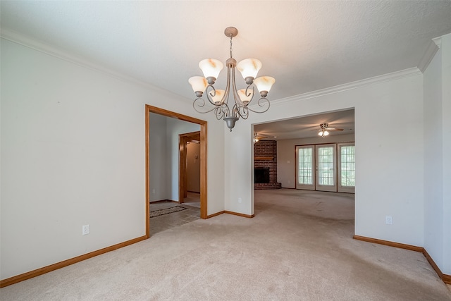 empty room featuring ceiling fan with notable chandelier, a textured ceiling, a brick fireplace, light carpet, and ornamental molding