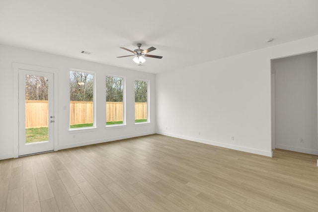 unfurnished room featuring ceiling fan and light hardwood / wood-style floors