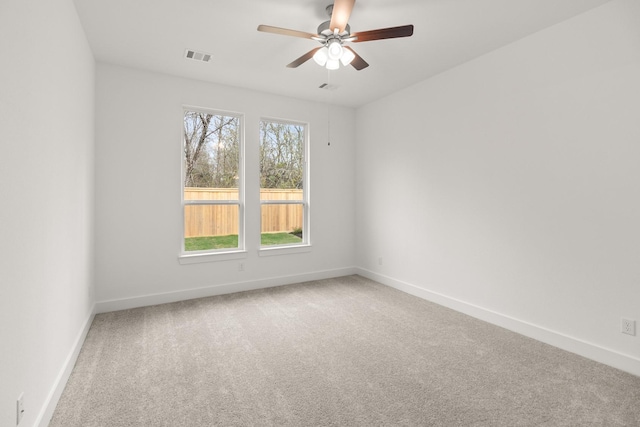 empty room with carpet and ceiling fan