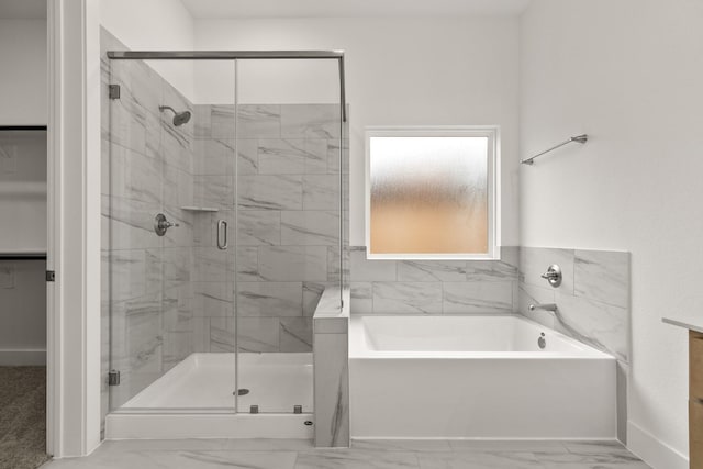 bathroom with shower with separate bathtub