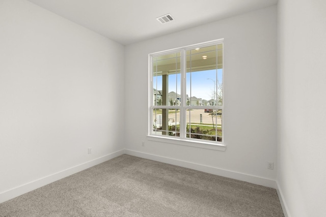 unfurnished room featuring carpet