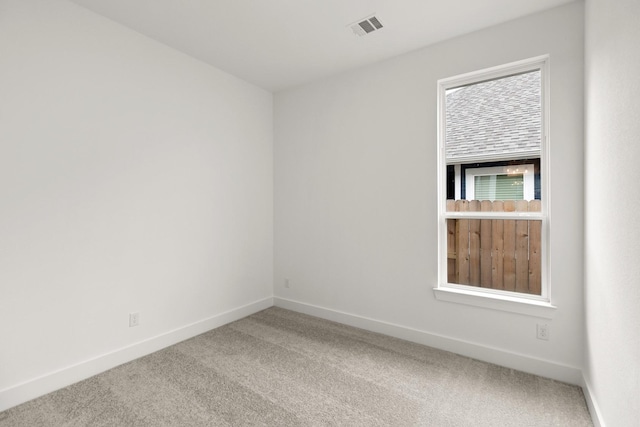 unfurnished room with carpet flooring