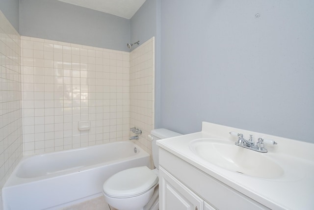 full bathroom featuring vanity, toilet, and tiled shower / bath