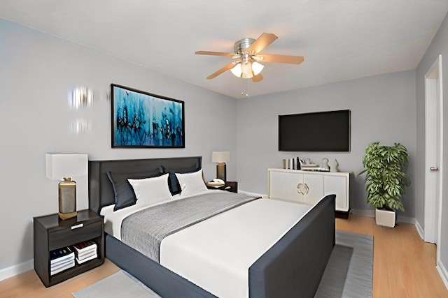 bedroom featuring ceiling fan and light wood-type flooring