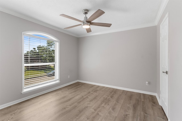 spare room featuring crown molding, ceiling fan, and light hardwood / wood-style floors