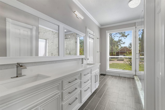 bathroom with vanity, a shower, and ornamental molding