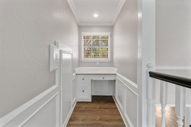 bathroom with wood-type flooring and ornamental molding