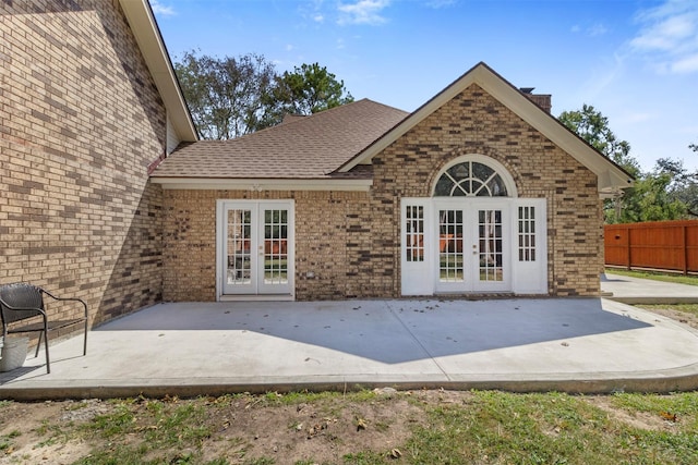 back of property with a patio area and french doors