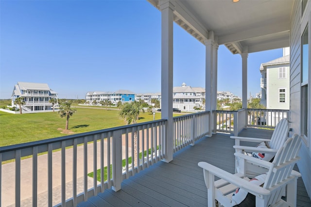 11707 Beachside, Galveston, TX 77554 - wooden terrace featuring a residential view and a yard