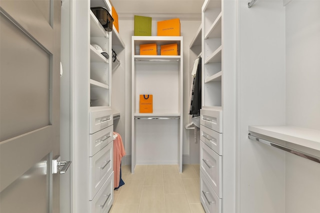 11707 Beachside, Galveston, TX 77554 - walk in closet with light tile patterned floors