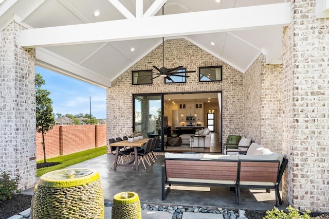 view of patio featuring an outdoor hangout area and ceiling fan