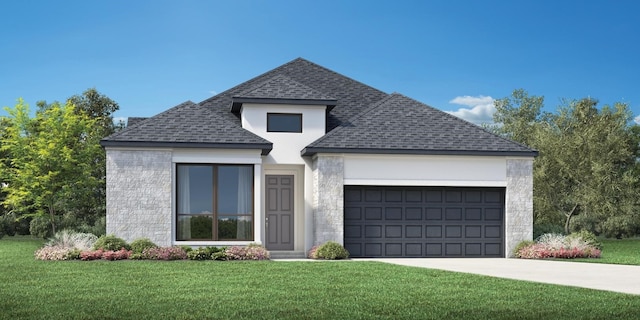 view of front of home featuring a front yard and a garage