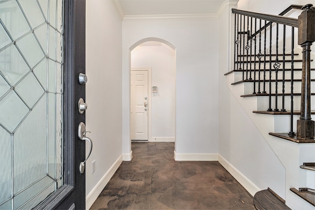 entryway featuring crown molding