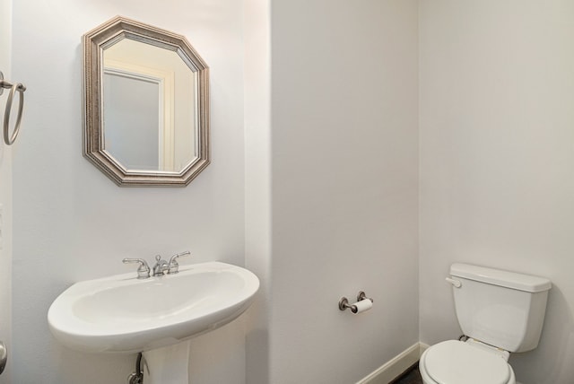 bathroom with toilet and sink