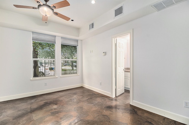 spare room with ceiling fan