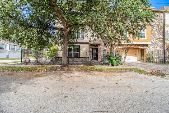 multi unit property featuring a garage