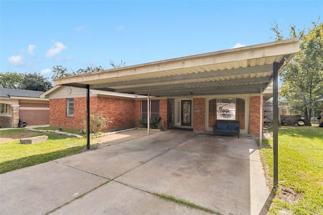 exterior space with a yard and a carport