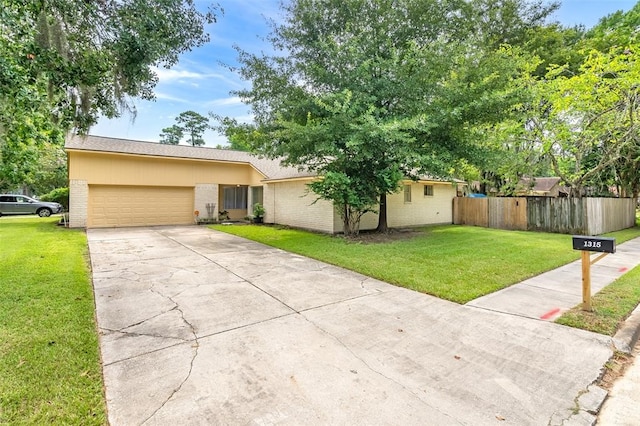 ranch-style home with a front yard and a garage