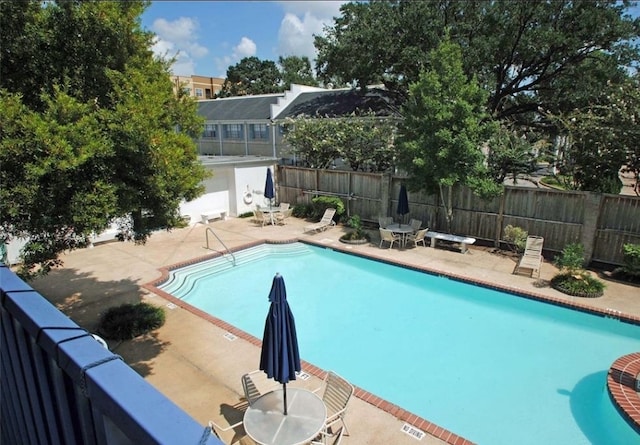 view of swimming pool featuring a patio area