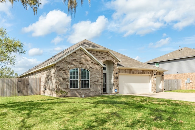 view of front of property featuring a front yard and a garage