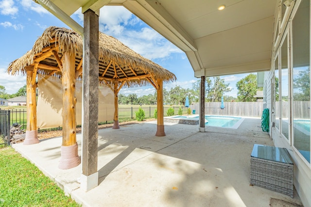 view of patio with a gazebo and a fenced in pool