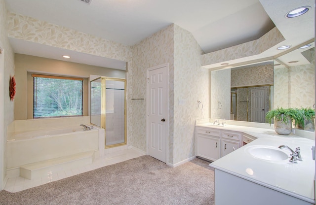 full bathroom with a shower stall, vanity, a bath, and wallpapered walls