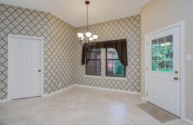 unfurnished dining area featuring a healthy amount of sunlight, a chandelier, and light tile patterned floors