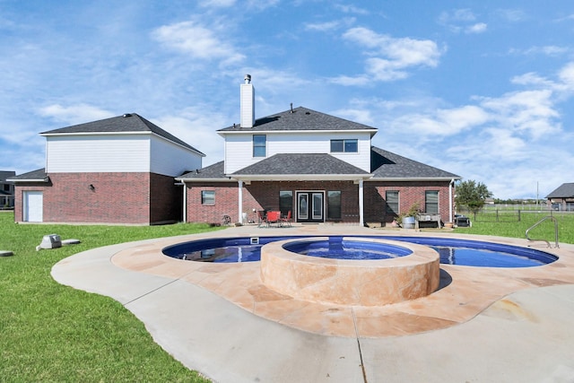 view of swimming pool featuring area for grilling, a yard, a patio, and an in ground hot tub