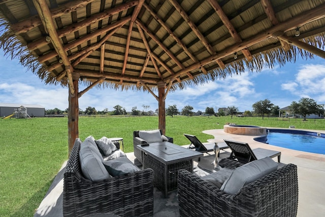 view of patio / terrace with a fenced in pool, a gazebo, and an outdoor living space