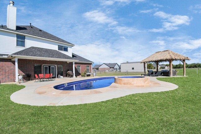 view of pool with an in ground hot tub, a patio area, a gazebo, and a lawn