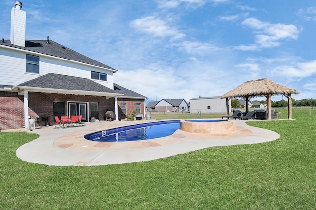 view of pool with a gazebo, a lawn, a patio, and an in ground hot tub