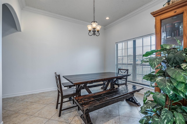 dining area with ornamental molding, a chandelier, and light tile patterned flooring