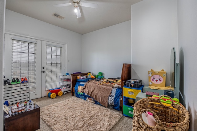 carpeted bedroom featuring access to exterior, french doors, and ceiling fan