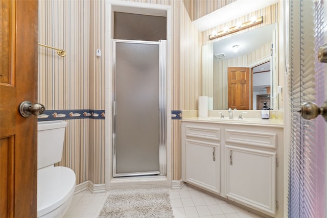 bathroom with toilet, an enclosed shower, and vanity